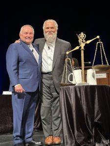 Robert A. Clifford with John Kapelos.