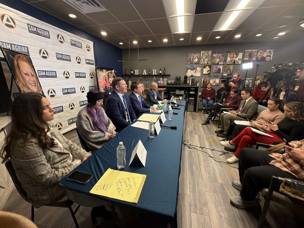 Clifford Law Offices attorneys speak to the press on December 3.