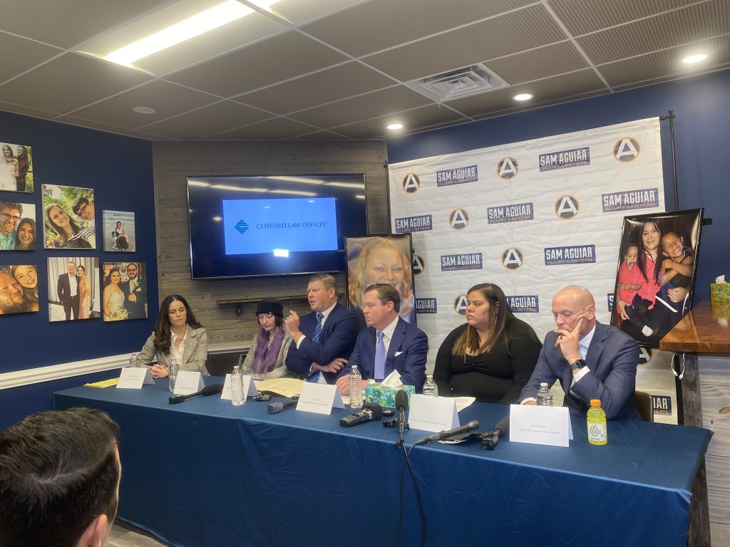 Bradley M. Cosgrove, partner at Clifford Law Offices, speaks to the press on December 3. 